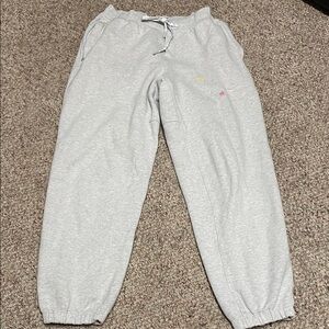Lululemon ladies Gray Sweatpants with pockets and embroidered accents